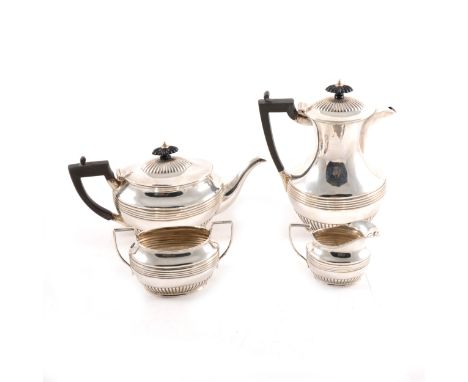 A four piece Scottish silver tea set by Hamilton and Inches, comprising teapot (12cm), hot water jug (19cm), milk jug and sug