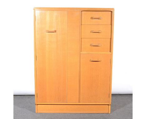 A G-Plan light oak compactum, fitted with two doors and three drawers, width 91cm.