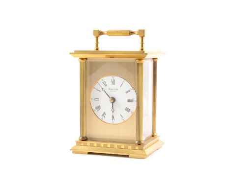 Phaeton by Acctim a modern brass carriage clock striking on a bell, white dial with roman numeral chapter ring and arabic out