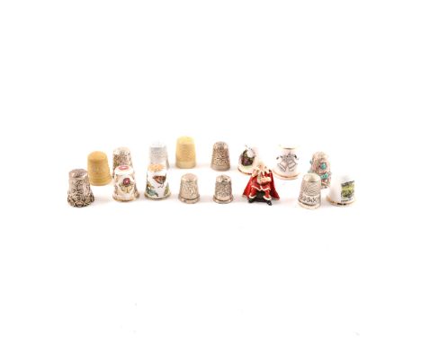 A collection of thimbles - silver, metal, ceramic in a vintage box, egg shaped cotton holder.