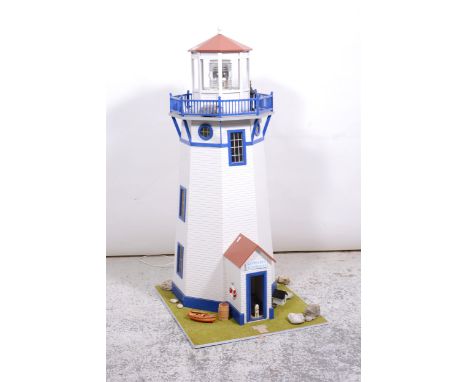 A modern doll's house lighthouse, Nantucket Lighthouse, with electric light, the lighthouse revolving with a landscaped platf