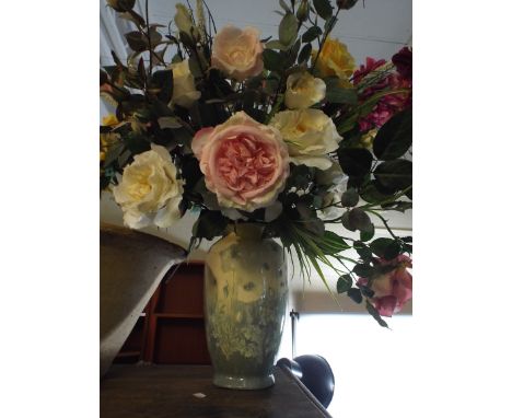 A Ceramic Vase Containing Artificial Flowers