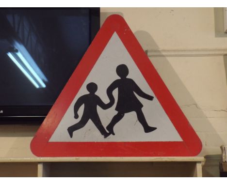 A Large Triangular Children Playing Road Sign