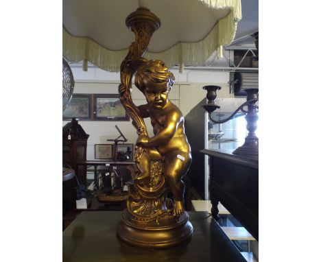 A Large Gilt Figural Table Lamp in the Form of Seated Cherub