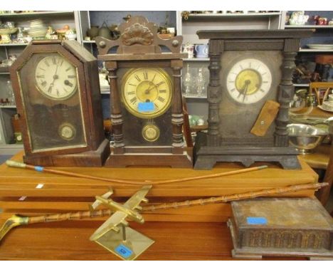 Three early wooden cased mantel clocks A/F, an oak musical box in the form of a coffer, a brass mounted spitfire, a regimenta