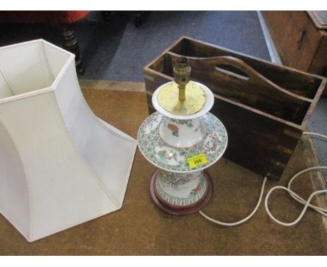 A modern Chinese ceramic table lamp with cream shade, together with a hardwood magazine rack with brass bracket corners 