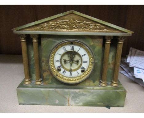 An early 20th century green onyx and gilt metal cased mantle clock of architectural form 