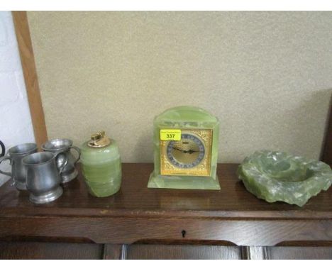 An Elsinore onyx cased mantel clock, an onyx table lighter and ashtray and three pewter mugs 
