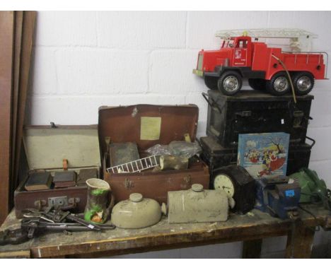 A mixed lot to include books, a Fire Brigade truck, a Smiths clock, boxes and other items 