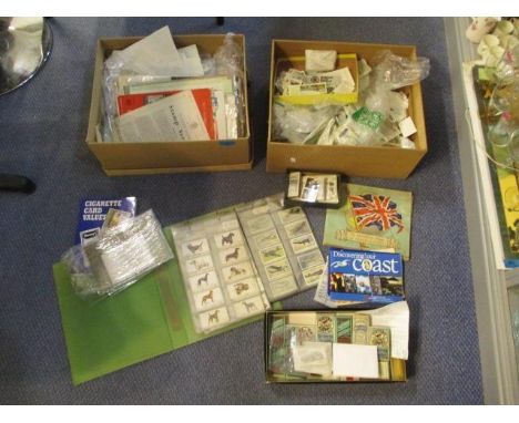 A mixed lot of ephemera to include mostly cigarette cards, transport tickets, travelling booklets and other items 