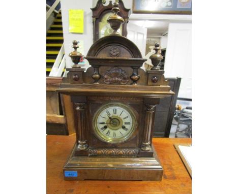 An HAC fourteen day alarm clock with walnut case with enamel Roman dial, with pendulum and key 