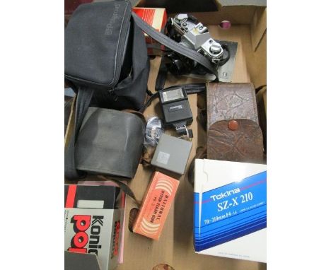 Photographic equipment to include a Cannon 35mm camera, a Tokina SZX 210 lens and other items 