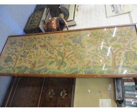 An early 20th century mahogany framed and glazed tapestry depicting birds in blossoming trees, 20" x 59 1/4" 
