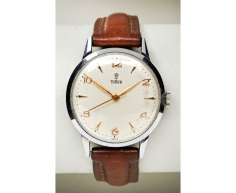 TUDOR STEEL MANUAL WIND WRISTWATCH, 1950s, with gold wedge indexes and Arabic numerals with later stitched leather strap. PRO