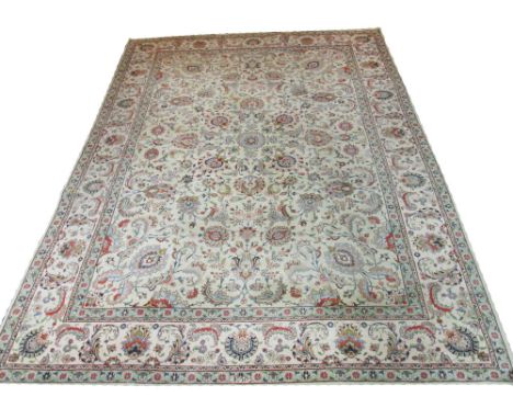 FINE SIGNED PERSIAN ANTIQUE TABRIZ CARPET, 394cm x 280cm, all over design of scrolling vines and palmettes on an ivory field 