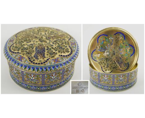 RUSSIAN SILVER GILT AND ENAMEL BOX, 20th century of circular form the lid decorated cherubs, hallmarks to base, 13.5cm diam x
