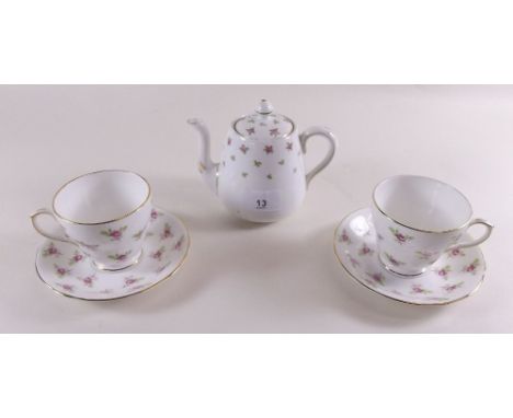 A matched Crown Staffordshire and Duchess coffee set printed roses comprising: twelve cups and saucers, small covered pot and
