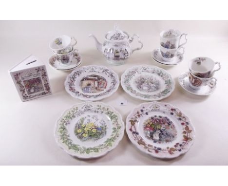 A collection of Brambly Hedge comprising: teapot, four wall plates, five cups and saucers, mug and money box 