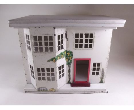 A small vintage dolls house with sliding metal door 