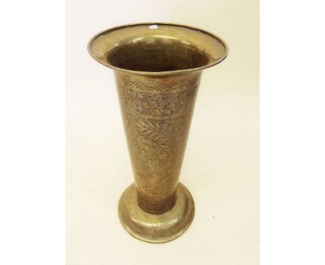 An Eastern heavy brass tapered stick stand with engraved decoration 