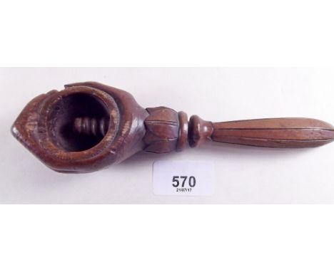 A 19th century treen novelty nutcracker in the form of a clenched hand