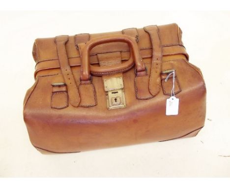 A vintage leather Gladstone bag 