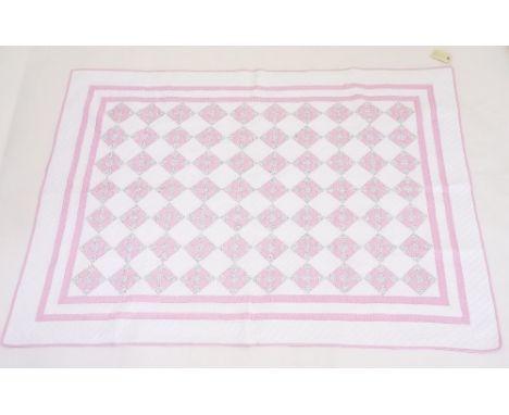 An early 20th century American nine patch quilt 150 x 112cm