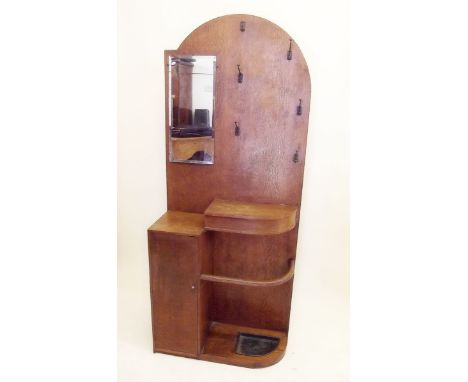 An oak 1920's Art Deco hall stand with stick stand and cupboard 