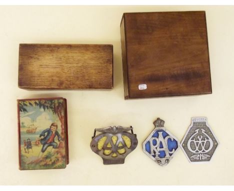 Three old car badges, two boxes and a Chad Valley money box