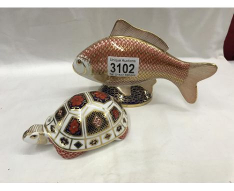 A Royal Crown Derby fish with gold stopper and a Royal Crown Derby tortoise with no stopper.