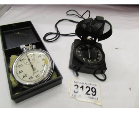 A Russian stop watch and a compass.