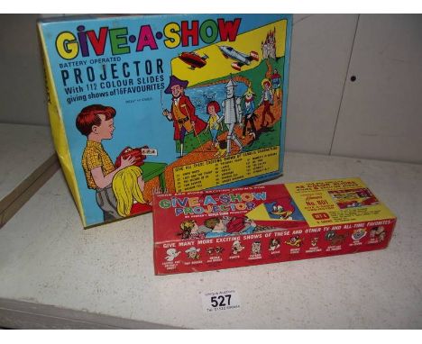 A Chad Valley give-a-show projector complete with extra box of slides