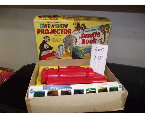 A Chad valley Give-A-Show projector in box complete with slides, Walt Disney, Jungle Book etc.