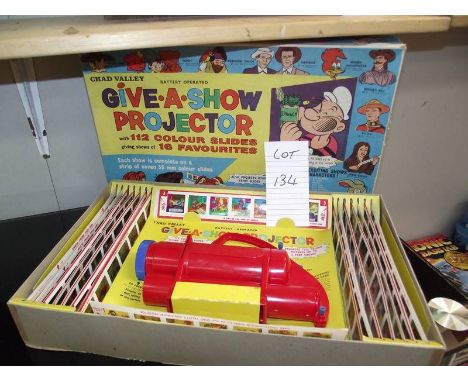 A Chad valley Give-A-Show projector in box complete with slides