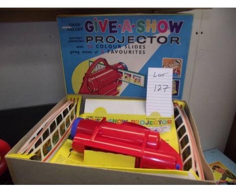 A Chad valley Give-A-Show projector in box complete with slides