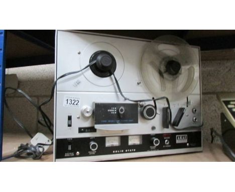 An Akai 4000D reel to reel tape recorder.
