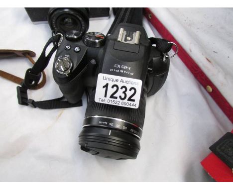 A Fugi film fine pix HS10 camera & 1 other Fuji camera
