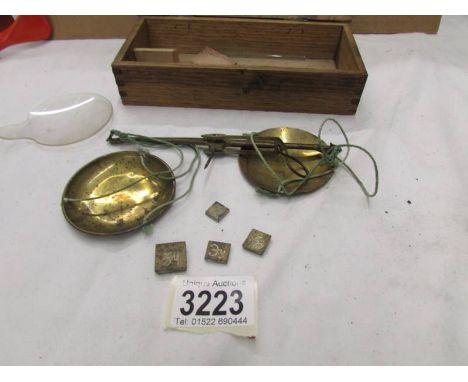 A set of Brass scales in oak box.