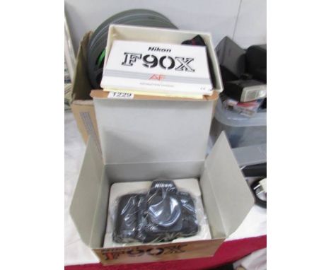 A boxed Nikon 90 camera, unused.