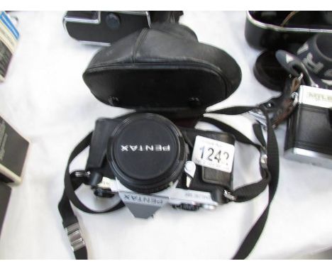A Pentax ME Super camera.