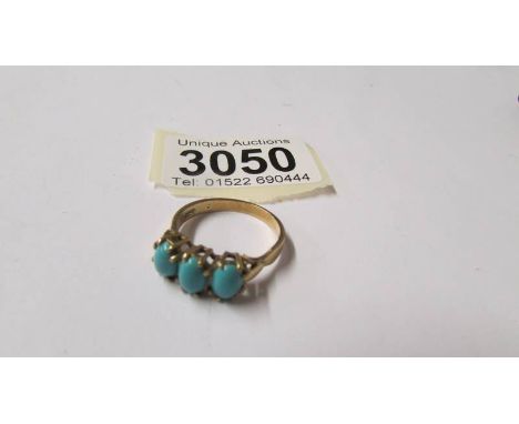 A 9ct gold ring set turquoise coloured stones, size S.  Total weight 3.4 grams.