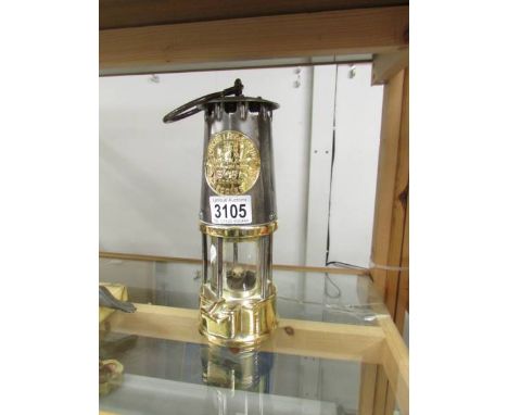 A brass miner's lamp.