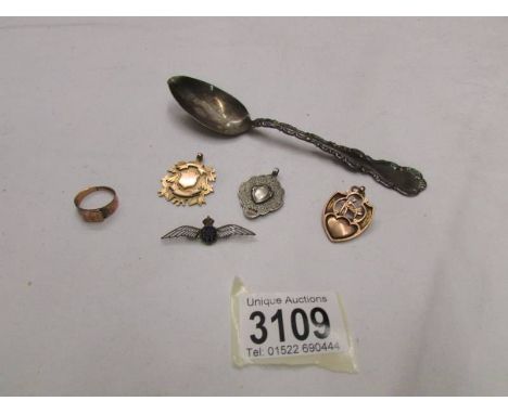 A 9ct gold fob (5.1g), a 9ct gold fob (6.6g), a gold ring (2.7g), a silver fob (7.4g) and an RAF badge.