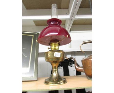 A brass Aladdin oil lamp.