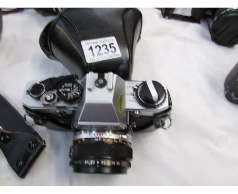 An Olympus OM10 camera.