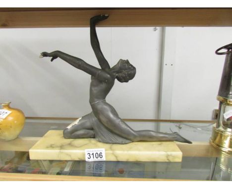 An art deco figure table lamp, needs re-wiring. ****Condition report**** Figure appears to be marble with a metal painted fin