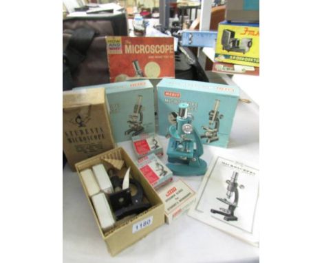 4 microscope sets with extra scientifically prepared slides etc.,