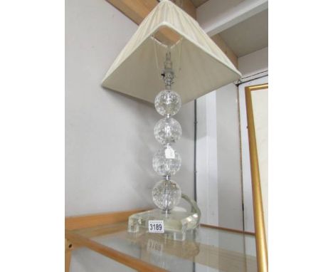 A table lamp with shade.