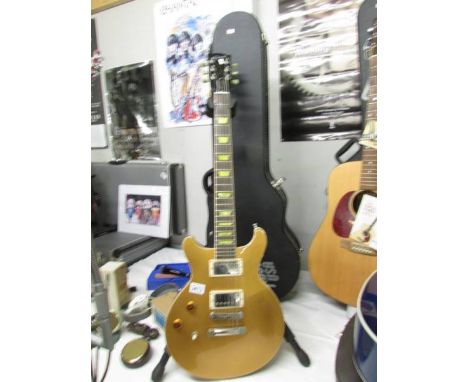 A USA Gold Gibson "Classic" Les Paul left hand guitar with original hard case.