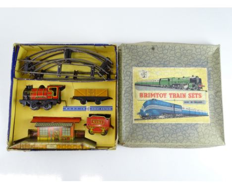 A BRIMTOY O gauge clockwork tinplate train set with a locomotive numbered 6161 - G in F box